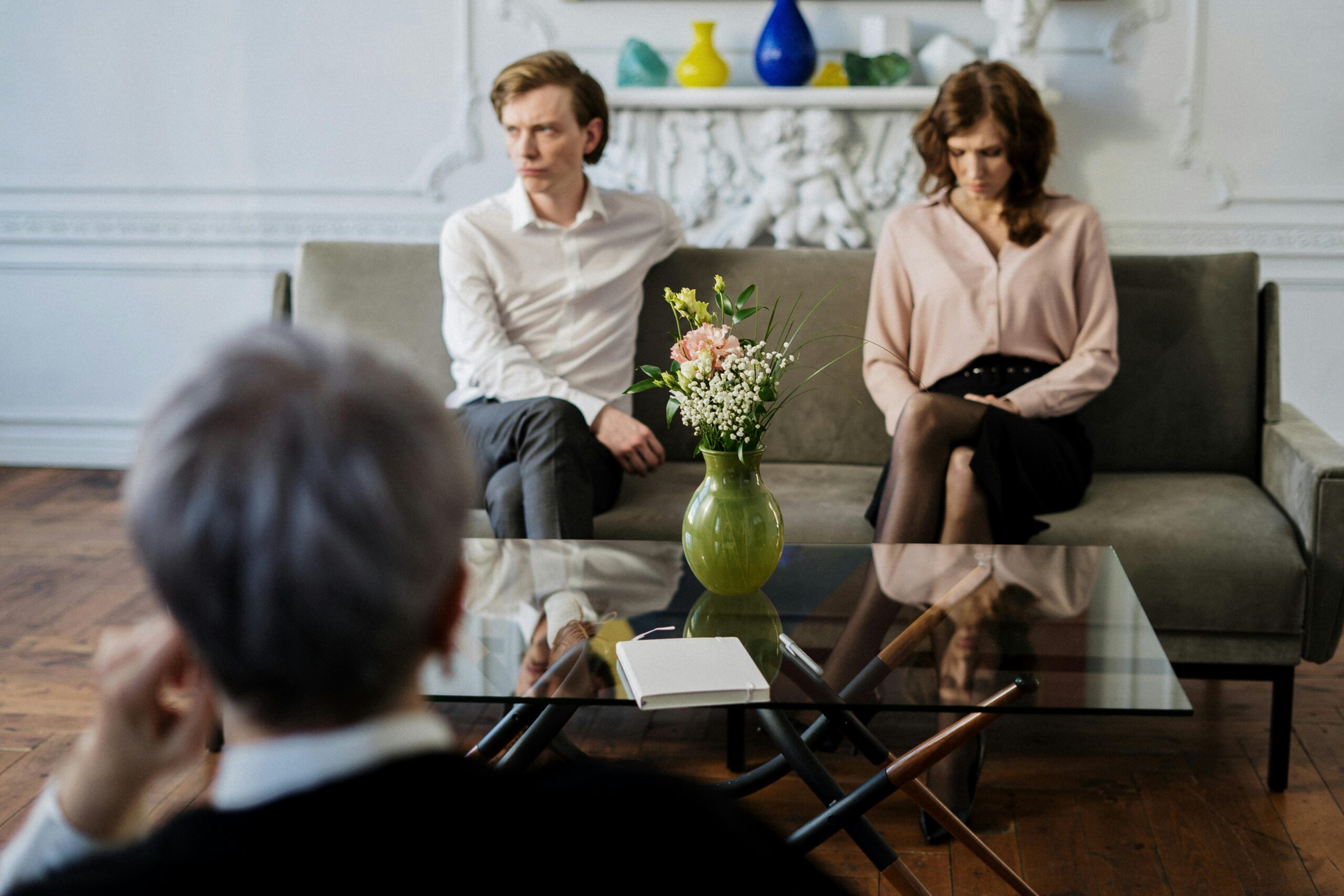 Psychologist guiding a couple through marriage counseling for better communication and understanding
